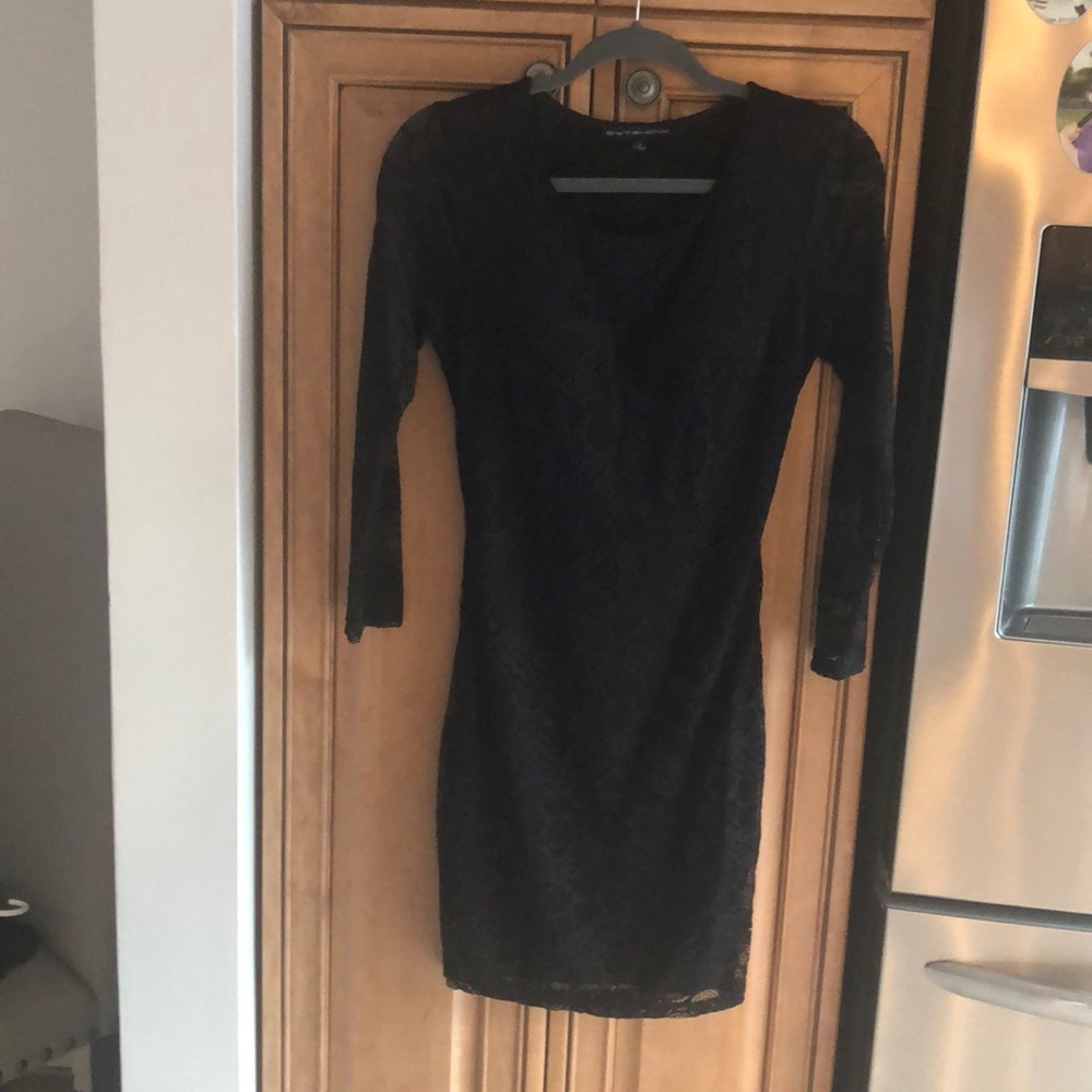 Black lace cocktail dress with open fringe back